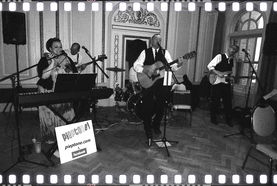 Pieptone! performing live, with vocals, keyboard, guitar, bass, and drums.